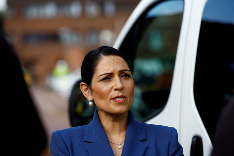 British home secretary Priti Patel looks on during a visit with members of the Thames Valley Police with prime minister Boris Johnson, at Milton Keynes Police Station in Milton Keynes, Britain on 
31 August, 2022