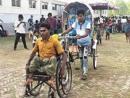 Hafez Ahmed had been afflicted with polio in his childhood in Myanmar. He received a rickshaw for his livelihood in Bhasan Char on Wednesday