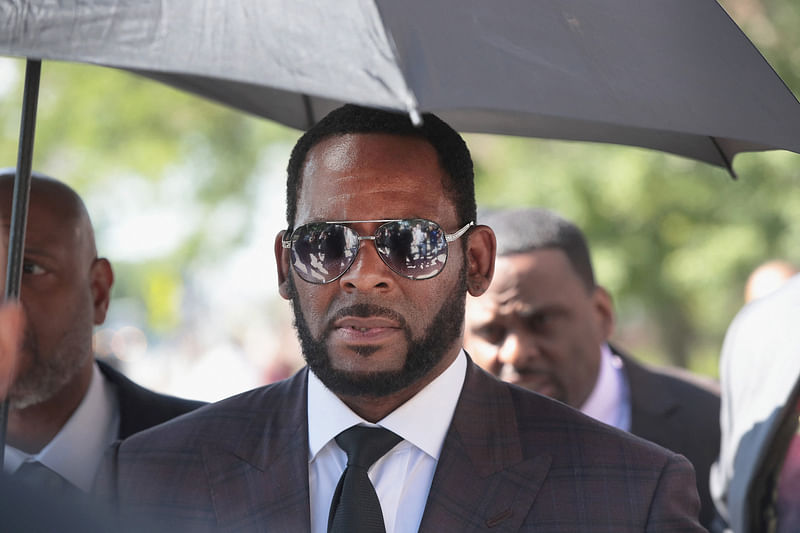 In this file photo taken on 26 June, 2019 singer R Kelly leaves the Leighton Criminal Courts Building following a hearing on 26 June 26, 2019 in Chicago, Illinois. Disgraced R&B singer R Kelly, who is serving a 30-year sentence for sex offenses, was found guilty of child pornography charges on 14 September, 2022 after a month-long trial in his hometown of Chicago. Kelly, whose full name is Robert Sylvester Kelly, was convicted of three counts of producing child pornography and three counts of enticement of a minor, the Chicago Tribune reported.