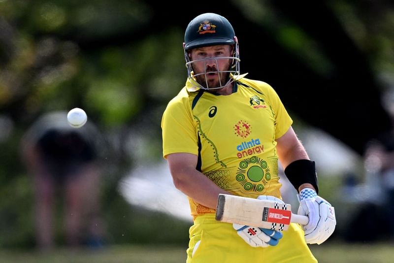 In this file photo taken on 3 September, 2022, Australia's captain Aaron Finch plays a shot during the third one-day international (ODI) cricket match between Australia and Zimbabwe at the Riverway Stadium in Townsville