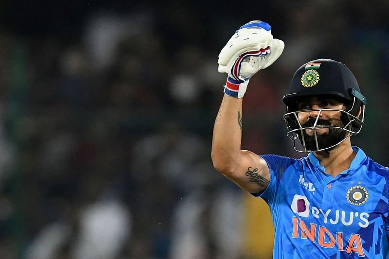 India's Virat Kohli celebrates after scoring a half-century (50 runs) during the third Twenty20 international cricket match between India and Australia at the Rajiv Gandhi International Cricket Stadium in Hyderabad on 25 September, 2022