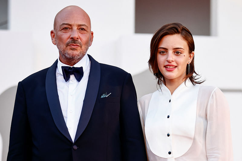 Premiere screening of the film "L'Immensita" in competition - Red Carpet Arrivals - Venice, Italy, 4 September, 2022. Director Emanuele Crialese and cast member Luana Giuliani pose.