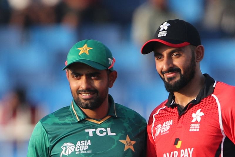 Pakistan's captain Babar Azam (L) and Hong Kong's captain Nizakat Khan pose before the start of the Asia Cup Twenty20 international cricket match between Pakistan and Hong Kong at the Sharjah Cricket Stadium in Sharjah on 2 September 2022.