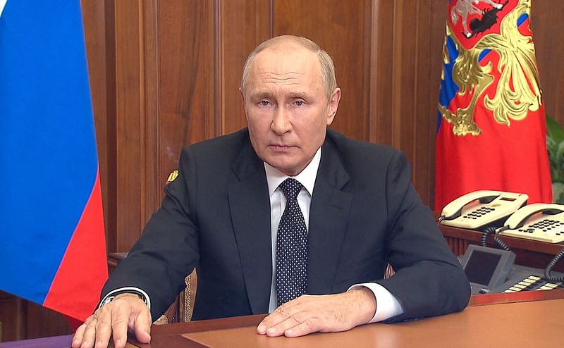 This handout picture released on on 21 September, 2022 by the Kremlin shows Russian President Vladimir Putin speaking during a televised address to the nation in Moscow