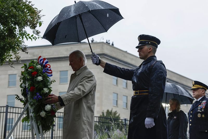 ARLINGTON, VIRGINIA - SEPTEMBER 11: U.S. President Joe Biden participates in a wreath-laying ceremony commemorating the 21st anniversary of the crash of American Airlines Flight 77 into the Pentagon during the September 11th terrorist attacks at the 9/11 Pentagon Memorial on 11 September, 2022 in Arlington, Virginia. The nation is marking the twenty-first anniversary of the terror attacks of 11 September, 2001, when the terrorist group al-Qaeda flew hijacked airplanes into the World Trade Center, Shanksville, PA and the Pentagon, killing nearly 3,000 people.