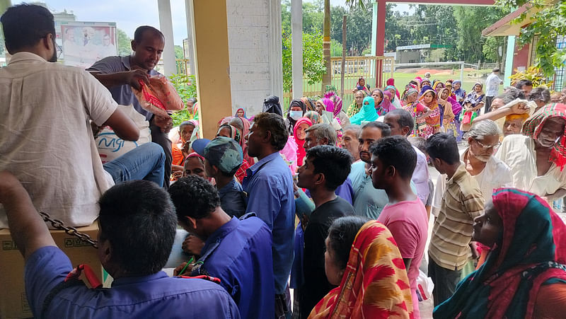 People from lower income group line up to purchase essential commodities from TCB. The picture was taken from Garpara in Manikganj