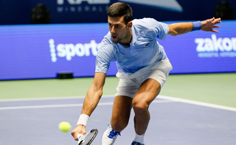 Serbia's Novak Djokovic returns a ball to Russia's Daniil Medvedev during their men's singles semi-final match at the Astana Open tennis tournament in Astana on 8 October, 2022