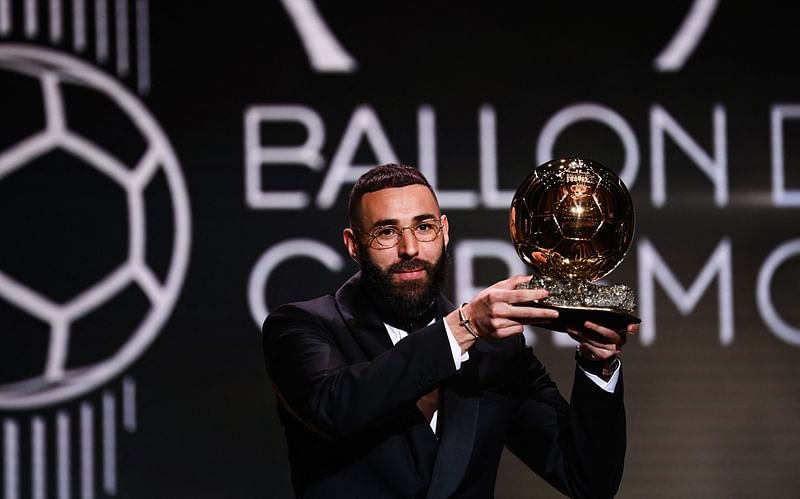 Real Madrid's French forward Karim Benzema receives the Ballon d'Or award during the 2022 Ballon d'Or France Football award ceremony at the Theatre du Chatelet in Paris on 17 October, 2022.