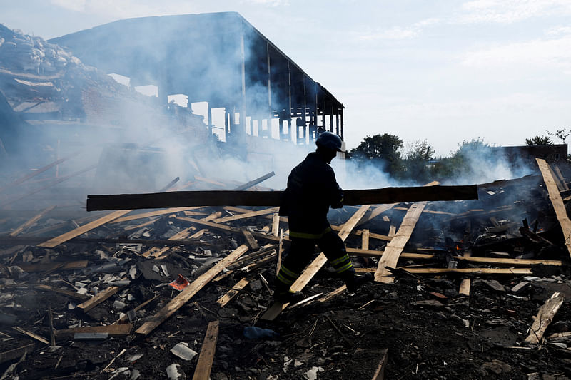 A Ukrainian firefighter removes rubbles in a factory destroyed by a Russian strike in the city of Slovyansk, in war-affected area in eastern Ukraine, as Russia's attack in Ukraine continues, in Donetsk region, Ukraine, on 27 August, 2022