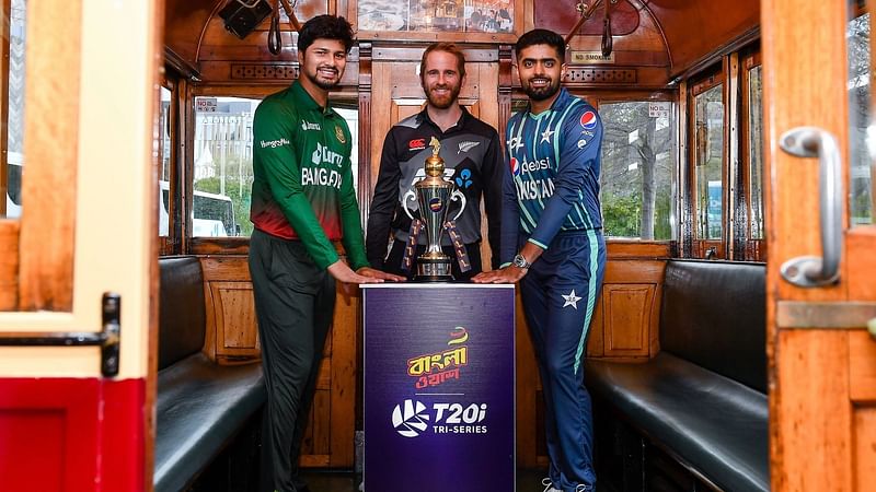 Bangladesh vice-captain Nurul Hasan, New Zealand captain Kane Williamson and Pakistan captain Babar Azam pose with the Bangla Wash T20I Tri-series trophy in Christchurch on 5 October, 2022