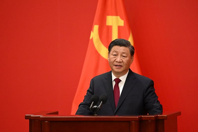 China's President Xi Jinping speaks after introducing members of the Chinese Communist Party's new Politburo Standing Committee, the nation's top decision-making body, in the Great Hall of the People in Beijing on 23 October 2022.