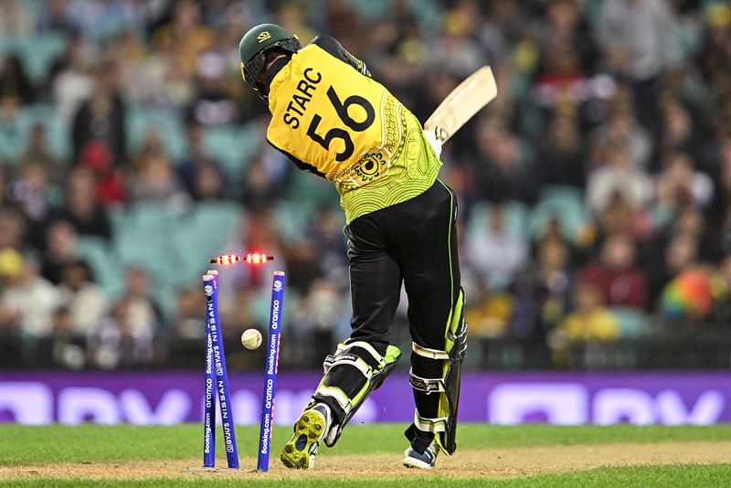 Australia's Mitchell Starc is bowled during the ICC men’s Twenty20 World Cup 2022 match between Australia and New Zealand at the Sydney Cricket Ground (SCG) in Sydney on 22 October, 2022