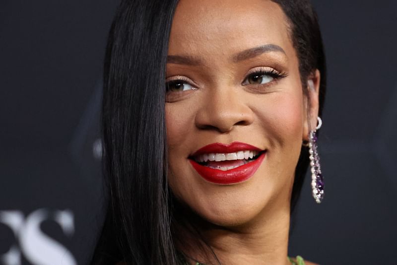 In this file photo taken on 11 February, 2022 Rihanna poses for a picture as she celebrates her beauty brands fenty beauty and fenty skin at Goya Studios in Los Angeles, California.