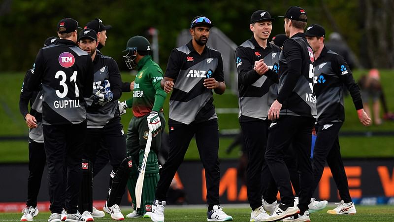 New Zealand players congratulate each other after their victory in the fifth cricket match between New Zealand and Bangladesh of the Twenty20 tri-series at Hagley Oval in Christchurch on 12 October, 2022