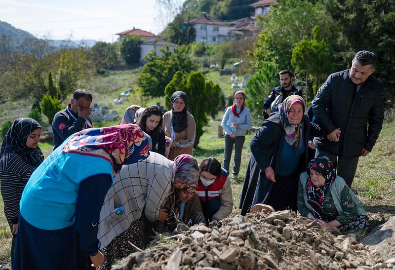 A woman reacts during a Selcuk Ayvaz funeral ceremony of miners who died after an explosion in a coal mine in Amasra, in Bartin Province, Turkey, on 15 October, 2022