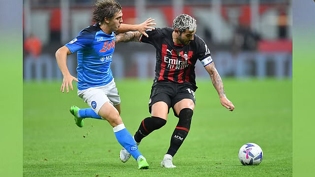 AC Milan's Theo Hernandez in action with Napoli's Alessio Zerbin