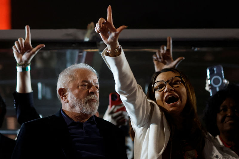 Brazil's former President and presidential candidate Luiz Inacio Lula da Silva stands next to his wife Rosangela da Silva, on the day of Brazil's presidential election, in Sao Paulo, Brazil October 2, 2022