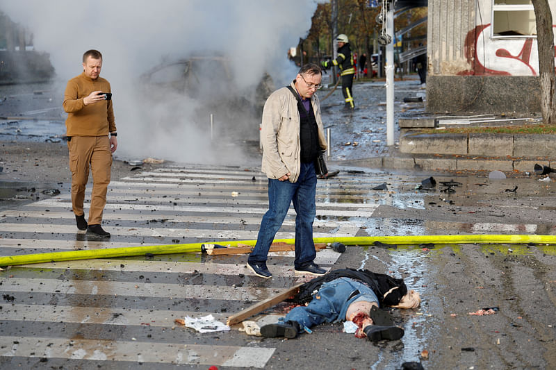 A dead body lies on the ground after Russian missile strikes, as Russia's attack continues, in Kyiv, Ukraine October 10, 2022