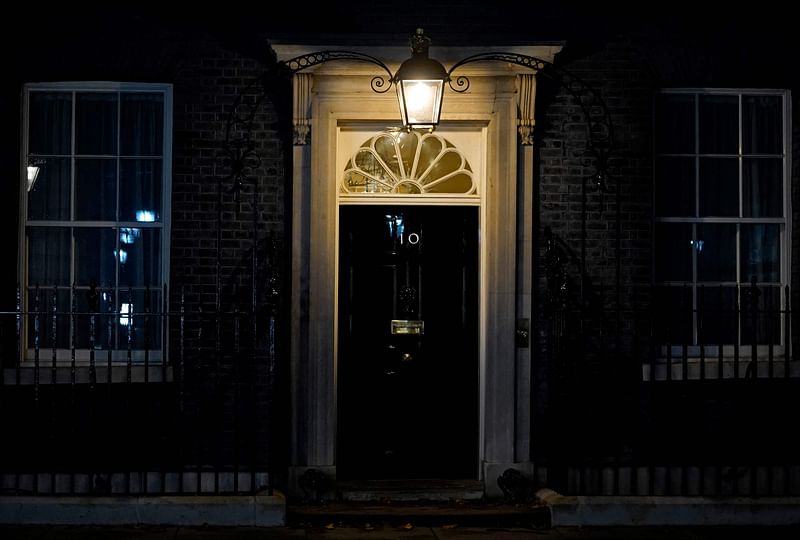 The closed front door to 10 Downing Street is pictured in central London, on 20 October, 2022, hours after UK's Prime Minister Liz Truss resigned as leader of the Conservative Party. British Prime Minister Liz Truss announced her resignation on after just six weeks in office that looked like a descent into hell, triggering a new internal election within the Conservative Party.