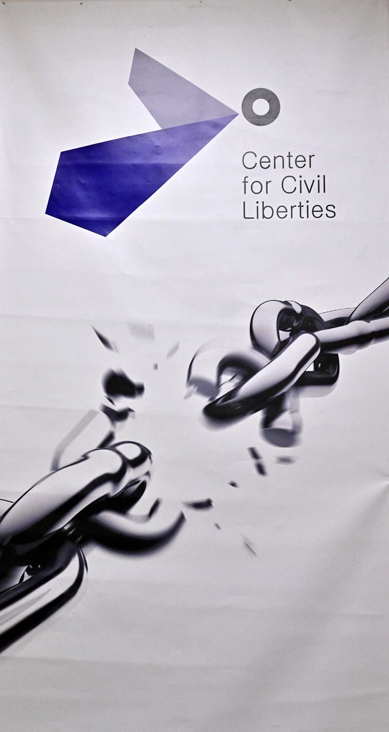 A photograph shows a poster of the Ukraine's Center for Civil Liberties in the office in Kyiv on 7 October, 2022. Russian President Vladimir Putin should face an "international tribunal", Oleksandra Matviychuk, the head of Ukraine's Center for Civil Liberties said on 7 October, 2022 after the group was awarded a Nobel Peace Prize.