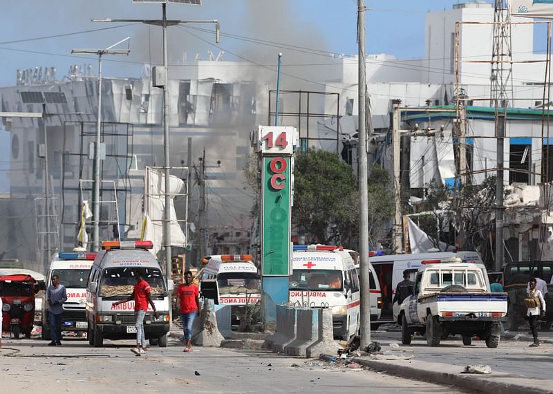 Security personnel and ambulances are stationed near destroyed and damaged buildings after an car bombing targeted the education ministry in Mogadishu on 29 October, 2022