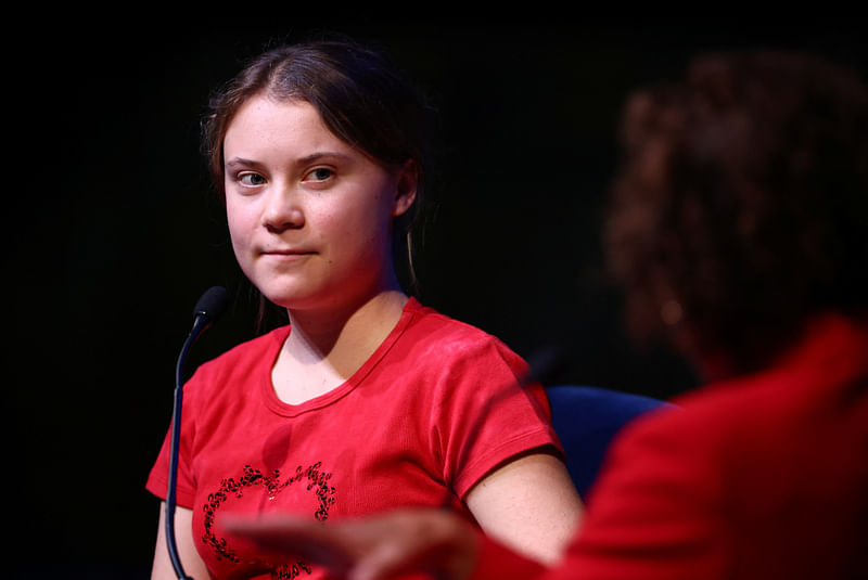 Swedish climate activist Greta Thunberg speaks with British journalist Samira Ahmed (not pictured) on stage at the Royal Festival Hall during the launch event of her new book "The Climate Book", during The Southbank Centre’s London Literature Festival, in London, Britain, 30 October, 2022.