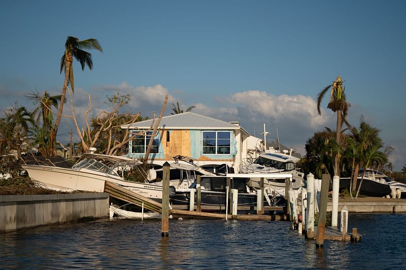 Storm damaged boats are strewn about in the wake of Hurricane Ian on 1 October, 2022 on Sanibel Island, Florida.