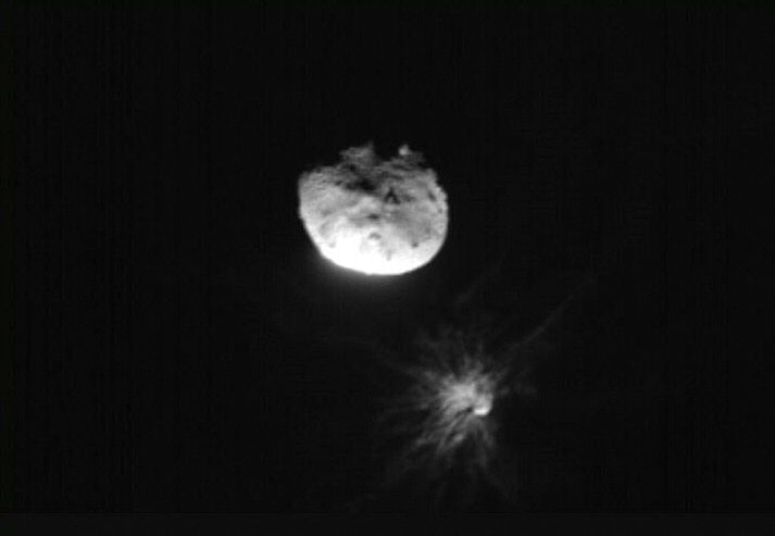 This handout picture obtained by the Italian Space Agency’s LICIACube shows the NASA's Double Asteroid Redirection Test (DART) mission just before its closest approach to the Dimorphos asteroid, on 26 September, 2022