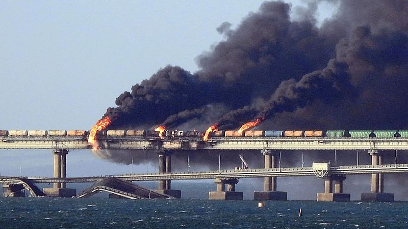 Black smoke billows from a fire on the Kerch bridge that links Crimea to Russia, after a truck exploded, near Kerch, on 8 October, 2022