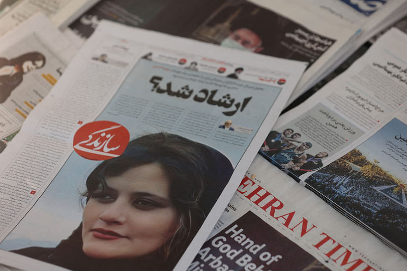 A newspaper with a cover picture of Mahsa Amini, a woman who died after being arrested by the Islamic republic's "morality police" is seen in Tehran, Iran on 18 September, 2022.