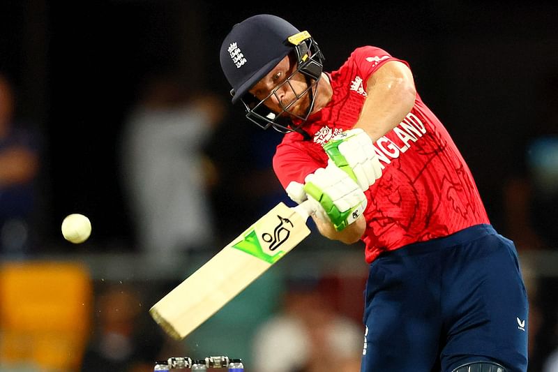 England's Captain Jos Buttler plays a shot for four runs