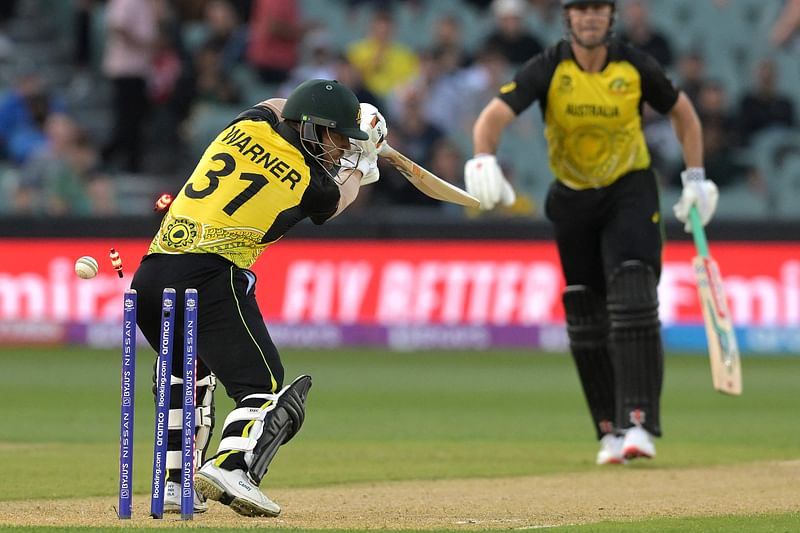 Australia's David Warner is clean bowled by Afghanistan's Naveen-ul-Haq during the ICC men's Twenty20 World Cup 2022 cricket match between Australia and Afghanistan at Adelaide Oval on 4 November, 2022