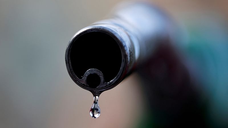 A drop of diesel is seen at the tip of a nozzle in a petrol station in Nice, France, 20 October, 2021