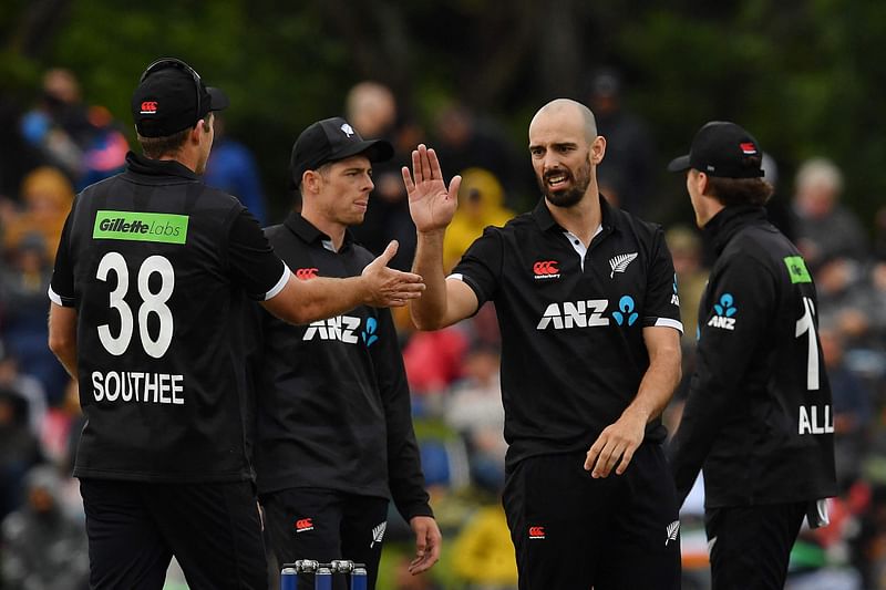 New Zealand's Daryl Mitchell (2nd R) celebrates the wicket of India's Arshdeep Singh during the third and final one-day international cricket match between New Zealand and India at Hagley Oval in Christchurch on 30 November, 2022