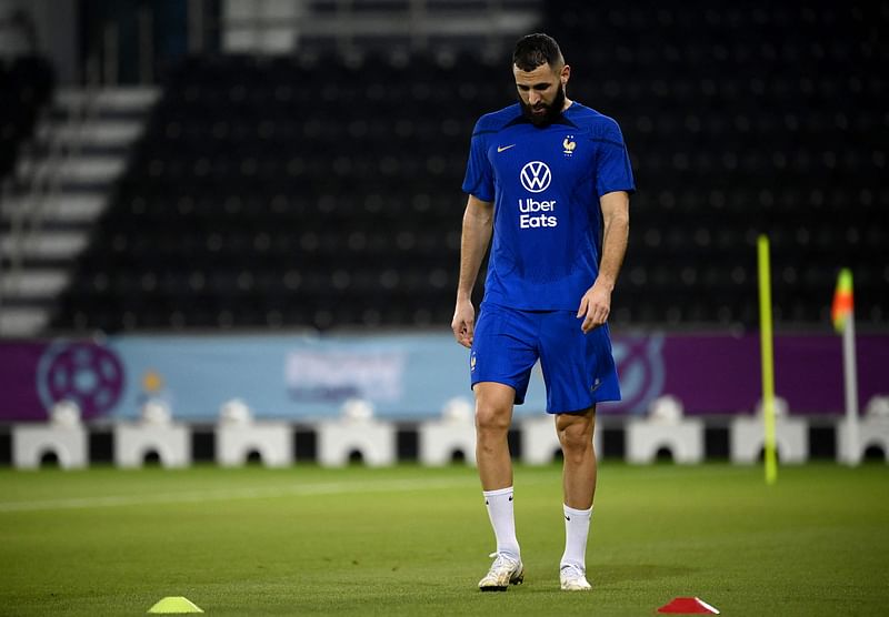 In this file photo taken on 17 November, 2022, France's forward Karim Benzema looks down during a training session at the Jassim-bin-Hamad Stadium in Doha