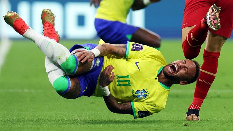 Brazil’s Neymar reacts after a challenge from Serbia’s Sasa Lukic in the Group G match of FIFA World Cup 2022 at Lusail Stadium, Lusail, Qatar on 24 November, 2022