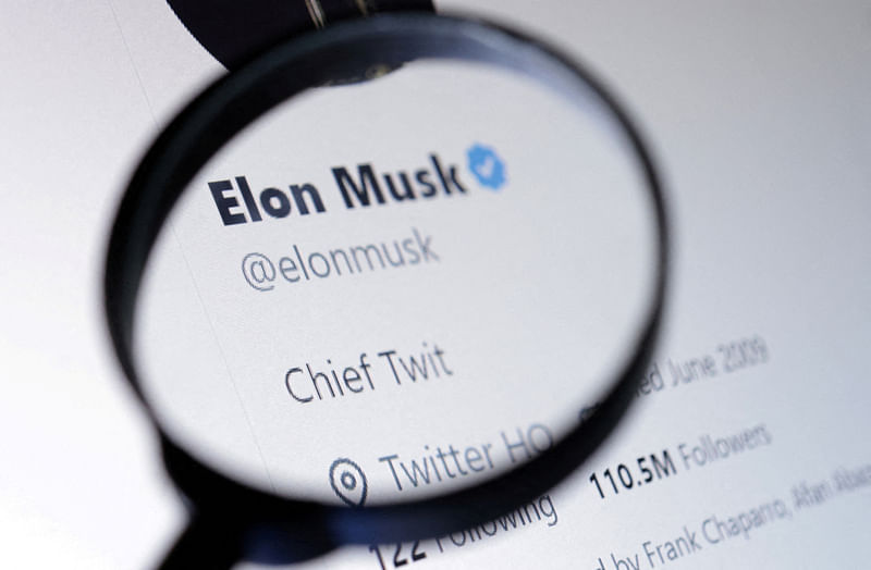 Elon Musk's Twitter account is seen through a magnifier in this illustration taken 28 October, 2022.