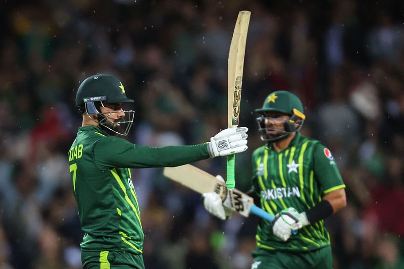 Pakistan’s Shadab Khan (L) reacts with teammate Iftikhar Ahmed after reaching fifty runs during the 2022 ICC Twenty20 World Cup cricket tournament match between Pakistan and South Africa at the Sydney Cricket Ground (SCG) on 3 November 2022.