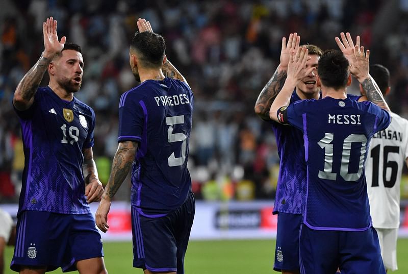 Argentina's forward Lionel Messi (R) celebrates with teammates after scoring during the friendly football match between Argentina and the United Arab Emirates at the Mohammed Bin Zayed Stadium in Abu Dhabi, on 16 November, 2022