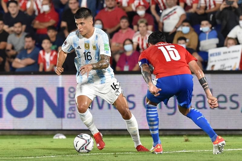 In this file photo taken on 7 October 7, 2021, Argentina's Joaquin Correa (L) is in action against Paraguay in Paraguay.