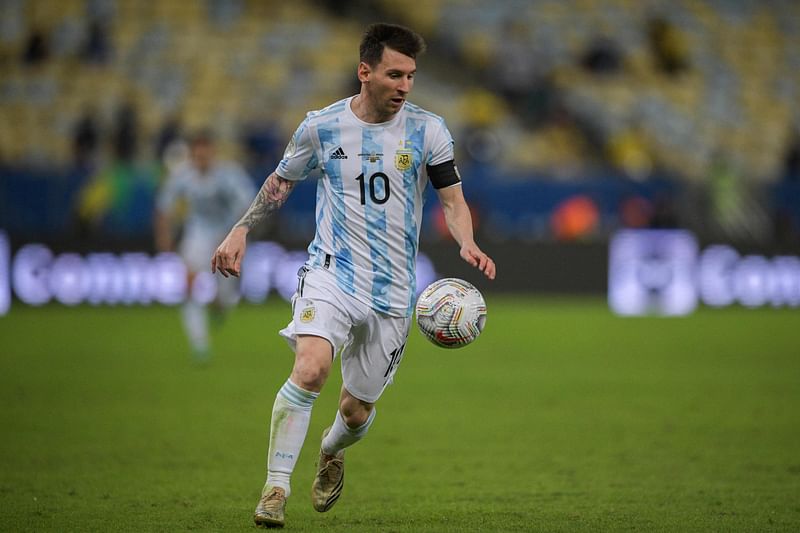 This file photo taken on 10 July, 2021 shows Argentina's Lionel Messi controling the ball during the Conmebol 2021 Copa America football tournament final match against Brazil at the Maracana Stadium in Rio de Janeiro, Brazil