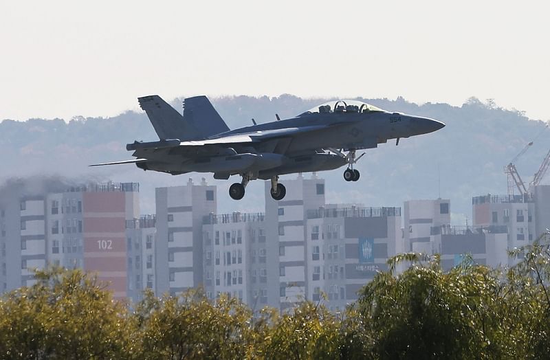 A US Air Force EA-18 Growler fighter jet flies on final to land at the Osan Air Base in Pyeongtaek on 4 November, 2022, as South Korea and US agreed to extend a joint aerial drill called "Vigilant Storm".