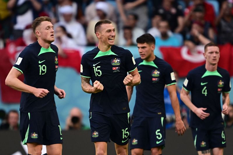 Australia's forward #15 Mitchell Duke celebrates scoring his team's first goal during the Qatar 2022 World Cup Group D football match between Tunisia and Australia at the Al-Janoub Stadium in Al-Wakrah, south of Doha on 26 November, 2022