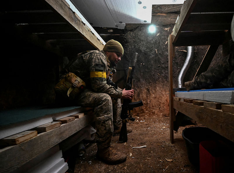 A serviceman rests in a dugout at his position on a front line, amid Russia's attack on Ukraine, in Zaporizhzhia region, Ukraine on 3 November, 2022.