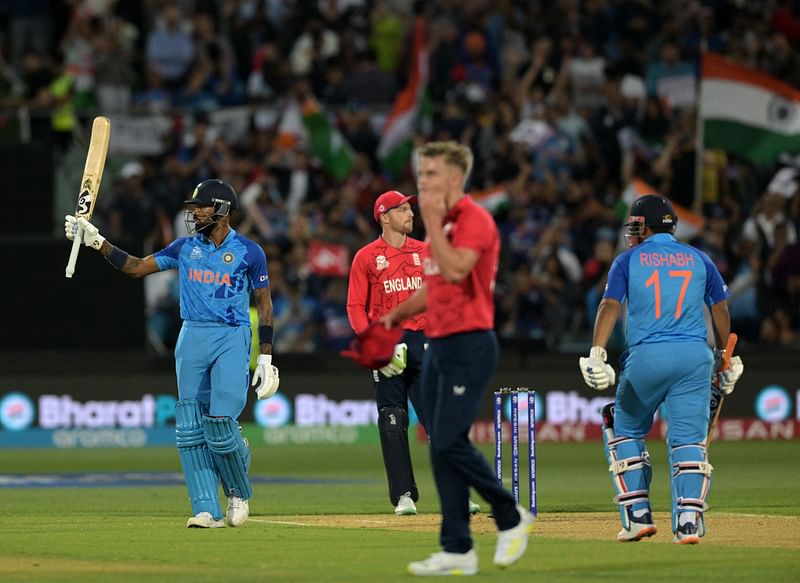 India's Hardik Pandya (L) celebrates after scoring a half-century (50 runs) with teammate India's Rishabh Pant (R) during the ICC men's Twenty20 World Cup 2022 semi-final cricket match England and India at The Adelaide Oval in Adelaide on 10 November, 2022