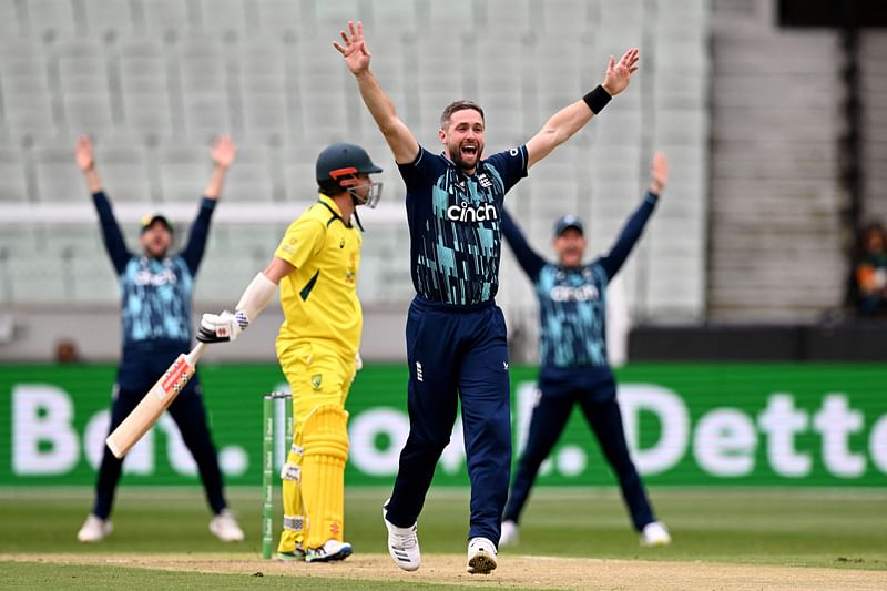 England's Chris Woakes (2/R) appeals for an LBW decision against Australia's Travis Head (2/L) during the third one-day international (ODI) cricket match between Australia and England at the MCG in Melbourne on 22 November, 2022