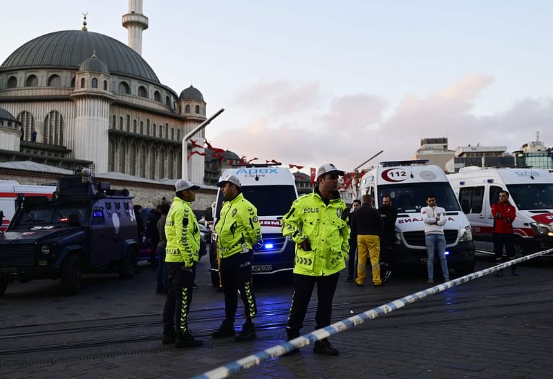 Turkish policemen try to secure the area after a strong explosion of unknown origin shook the busy shopping street of Istiklal in Istanbul, on 13 November, 2022