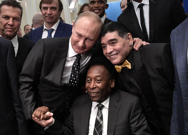 In this file photo taken on 1 December, 2017 Russian president Vladimir Putin, Brazilian football legend Pele and Argentina's former midfielder Diego Maradona pose for pictures ahead of the Final Draw for the 2018 FIFA World Cup football tournament at the State Kremlin Palace in Moscow