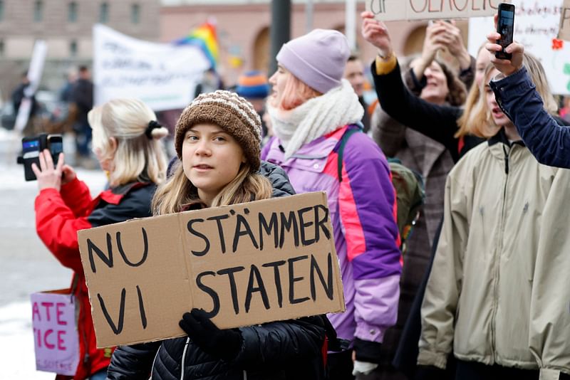 Swedish climate activist Greta Thunberg attends a climate demonstration called by youth-led organization Auroras before submitting its lawsuit against the state for their lack of climate work, in Stockholm on 25 November, 2022.