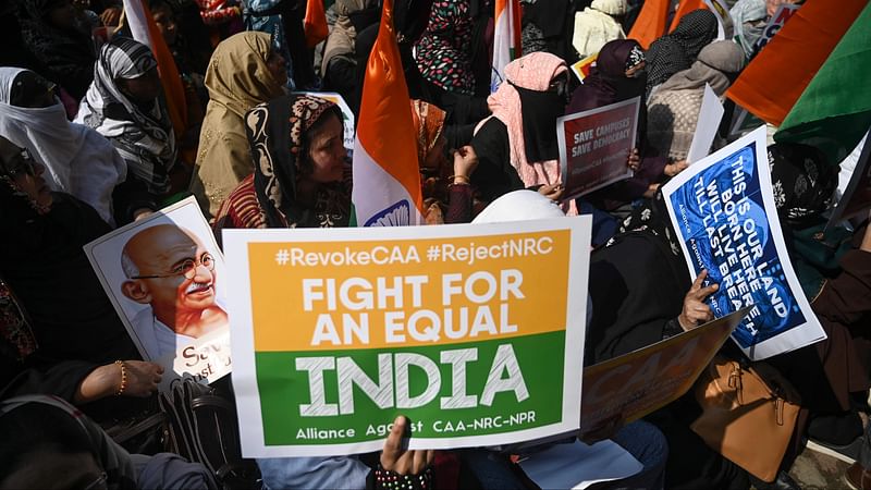 Protesters from Shaheen Bagh hold placards as they take part in a demonstration against India`s new citizenship law at Jantar Mantar, in New Delhi on 29 January 2020